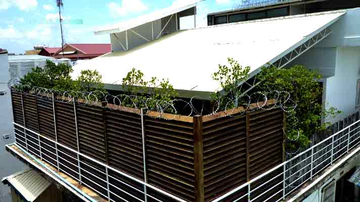 Barbed wire protected house Barbed wire